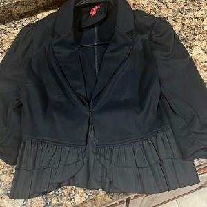 Elle size small jacket with ruffle bottom.